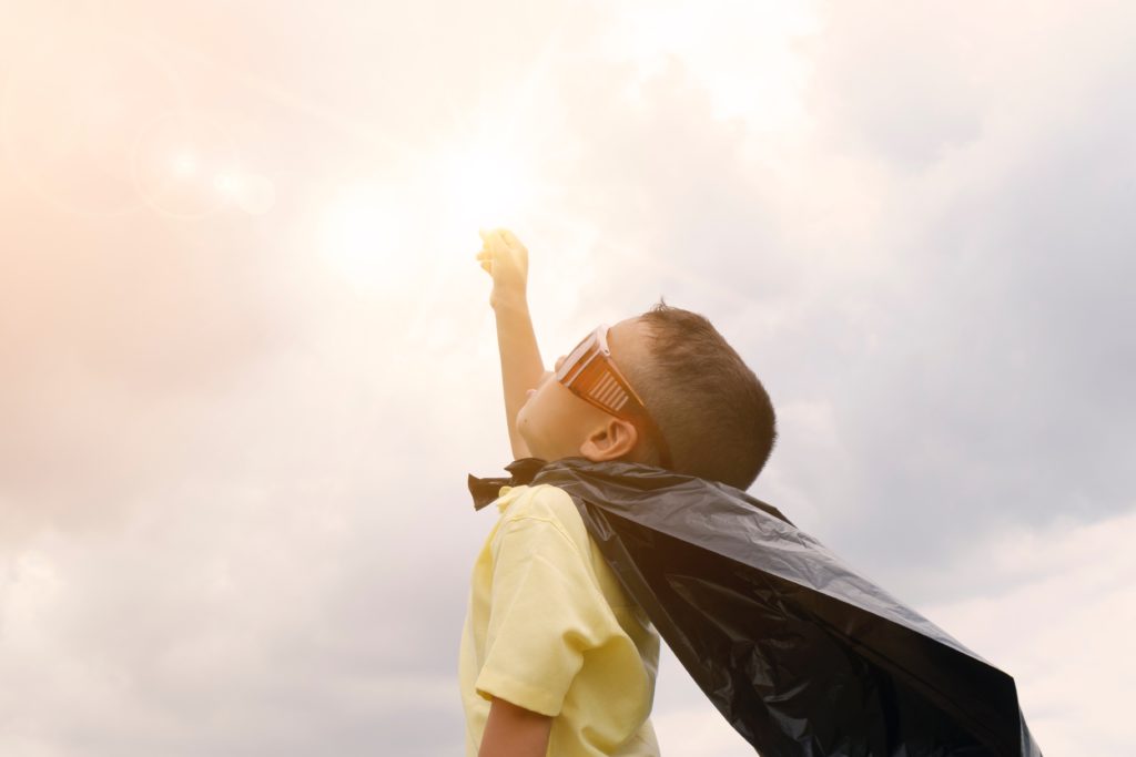 child dressed as superhero