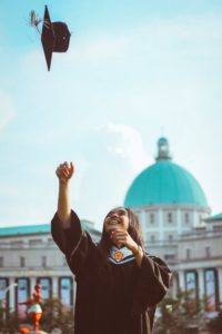 graduating student throwing cap