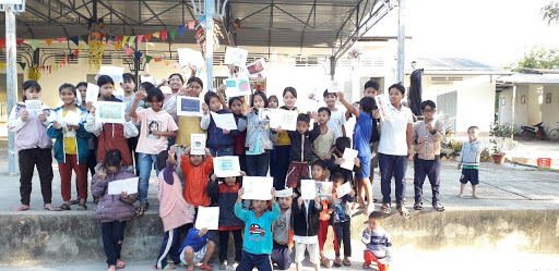 Children holding up letters they have recieved